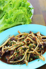 Spicy mushroom salad with lettuce green.