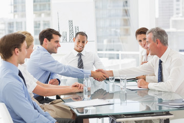 Business people making a deal at a meeting