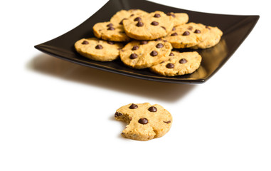 Chocolate chip cookies on a black plate