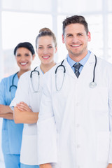 Confident happy group of doctors at medical office