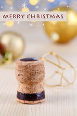 Champagne cork on Christmas lights background