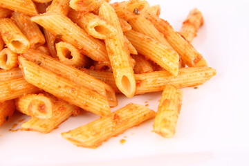 Pasta with pesto rosso decorated with cress