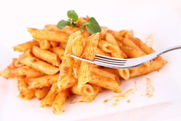 Pasta with pesto rosso decorated with cress