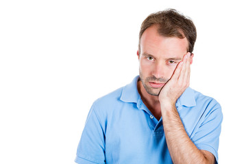 Sad, depressed young man, deep in thought