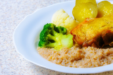 Roast meat with pickled cucumber and buckwheat