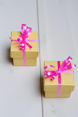 Gift boxes on white wooden plate