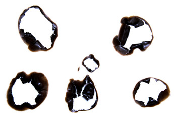 burned hole on a white paper background
