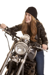 Fototapeta na wymiar woman black leather motorcycle big smile