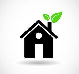 Eco house icon with green leaves in the chimney vector