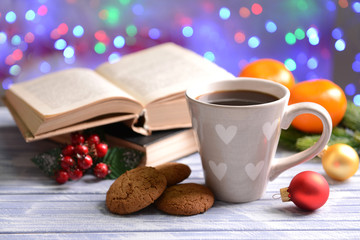 Composition of book with cup of coffee and Christmas