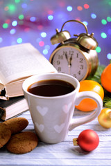 Composition of book with cup of coffee and Christmas
