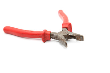 red pliers on white background