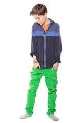 Fototapeta premium sensitive male teenager with hands in his pockets, isolated on w
