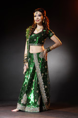 beautiful female wearing traditional indian costume posing