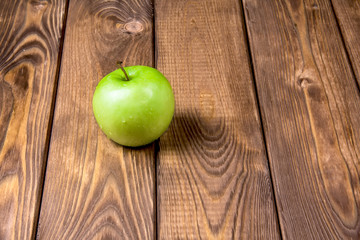 One  apple on a wooden background
