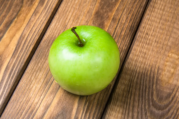 Apple on a wooden background close up