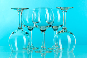 Glasses on light blue background