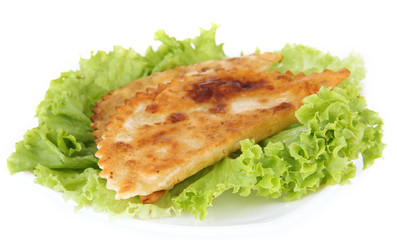 Tasty chebureks with fresh herbs on plate, close-up