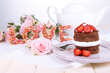 Chocolate cake with strawberry on wooden table close-up