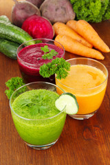 Fresh vegetable juices on table close-up