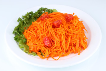 Carrot salad on plate isolated on white