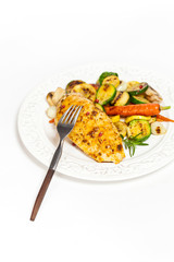 Grilled chicken breasts and vegetables