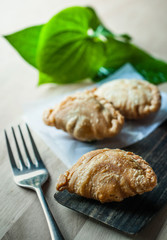 Snack of curry puffs on dish