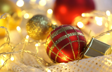 Christmas ornaments and garland on bright background close-up