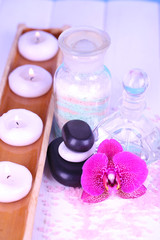 Beautiful spa setting with orchid on white wooden table