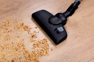 Vacuuming floor in house