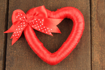 Decorative heart, on wooden background