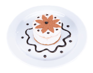 Sweet cake with chocolate on plate isolated on white