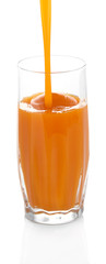 Juice pouring into glass isolated on white
