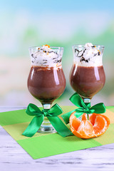 Tasty dessert with chocolate, cream and orange sauce,
