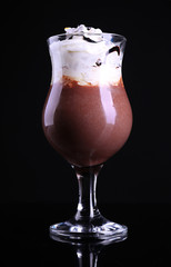 Tasty dessert with chocolate, cream and orange sauce, isolated