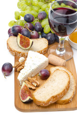 snacks - cheese, bread, figs, grapes, nuts and red wine