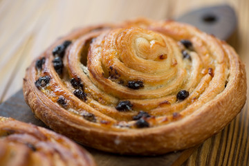 Fototapeta premium Spiral sweet french bun, close-up