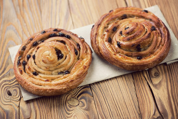 Obraz na płótnie Canvas Two french roll buns on a rustic wooden table