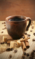 Fototapeta na wymiar cup of coffee on wooden background