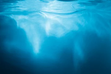 Foto op Plexiglas Abstract blue background. Water with sunbeams © Tim UR