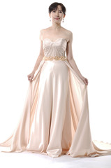 full-length young and beautiful bridge in dress in studio