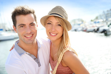 Portrait of cheerful couple of tourists