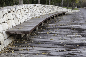 Fototapeta premium wooden bench in a public park