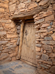 Old door in masonry with a ring