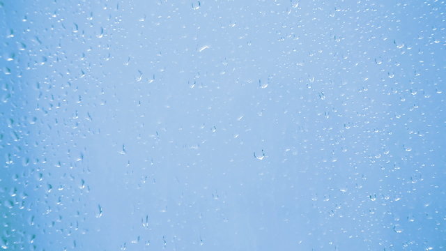 drops on glass - blue background