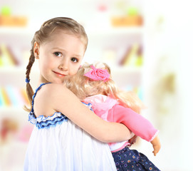 cute little girl with a doll