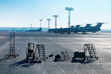 Airplane is being serviced by the ground crew.