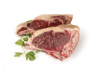 Two fresh rib eye steak isolated on white background