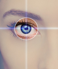 Fototapeta premium Eye technology, medicine and vision concept. Focus on woman eye