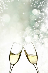 Glasses with champagne against holiday lights © erika8213